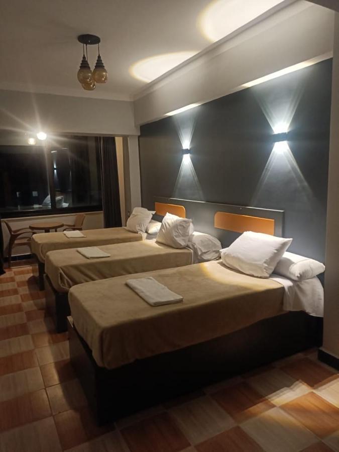 Royal Hotel Qinā Екстериор снимка